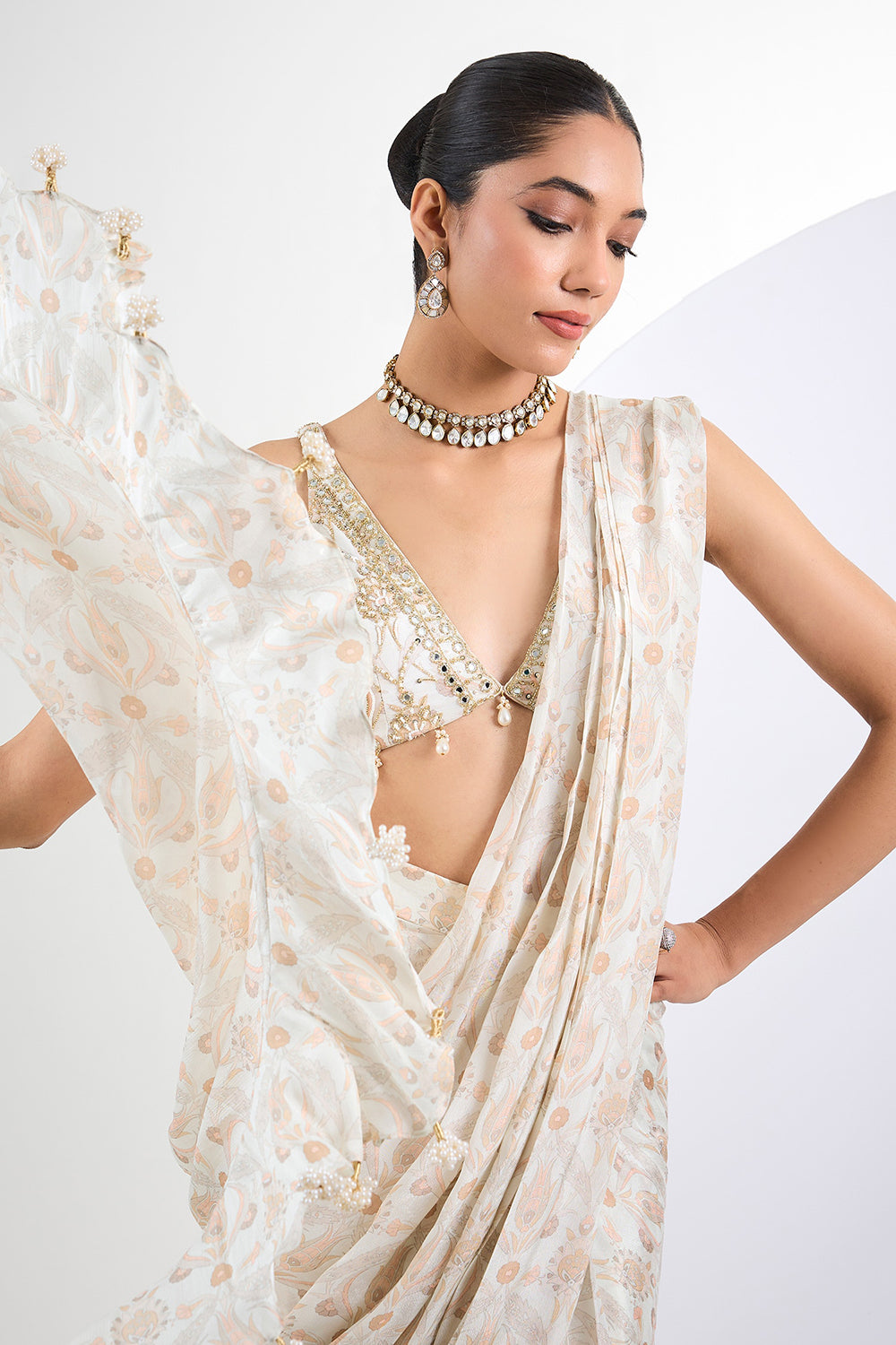 Printed chinon chiffon ivory pre draped saree with pearl tassels