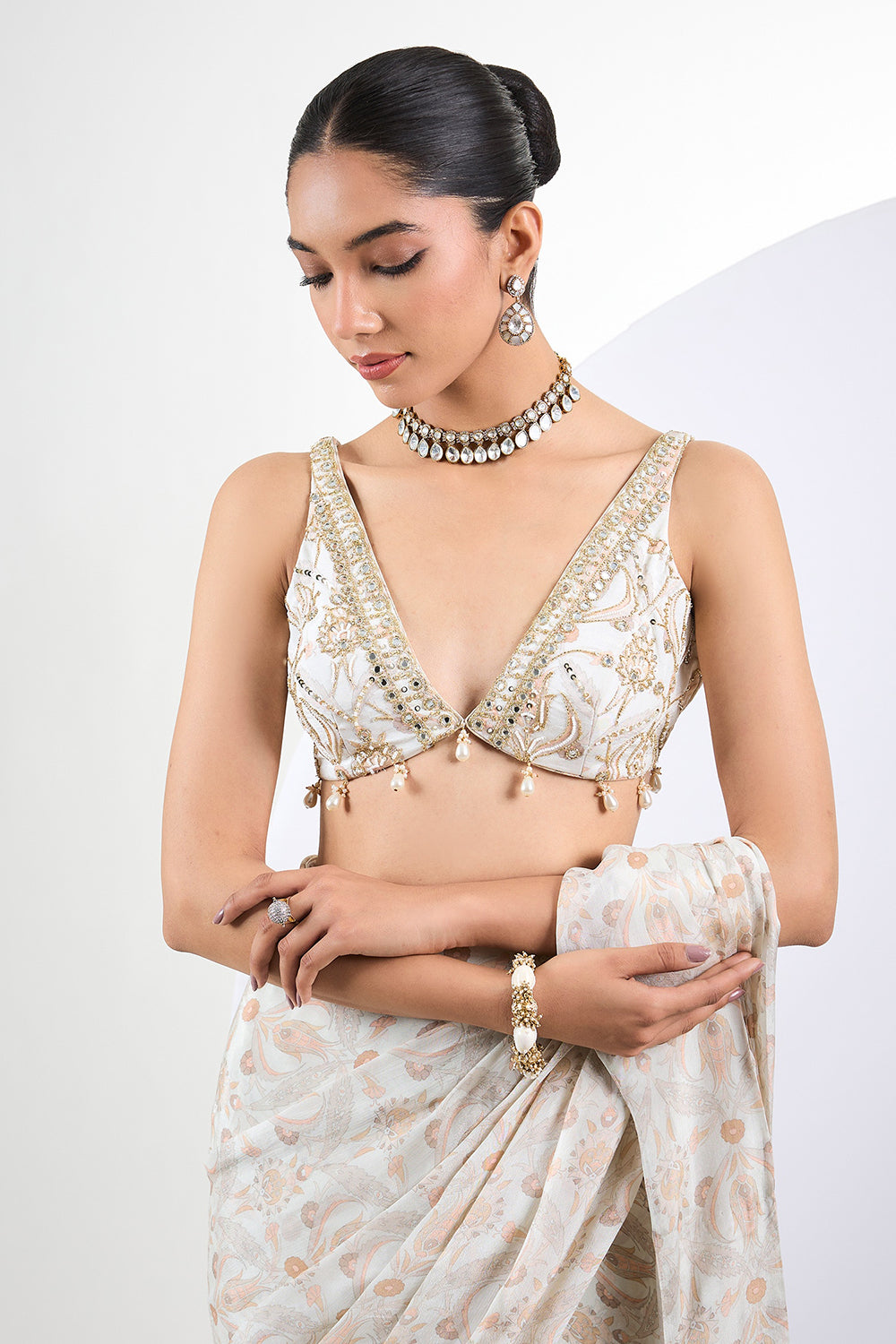 Printed chinon chiffon ivory pre draped saree with pearl tassels