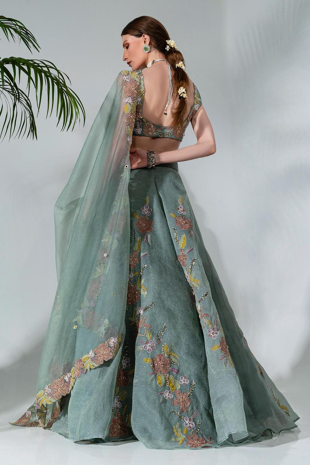 Dusty green  lehenga featuring floral applique patterns