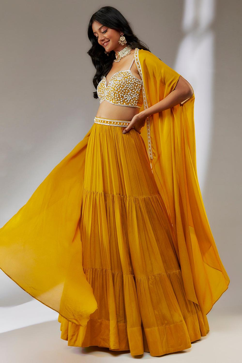 Yellow hand embroidered chiffon cape lehenga set