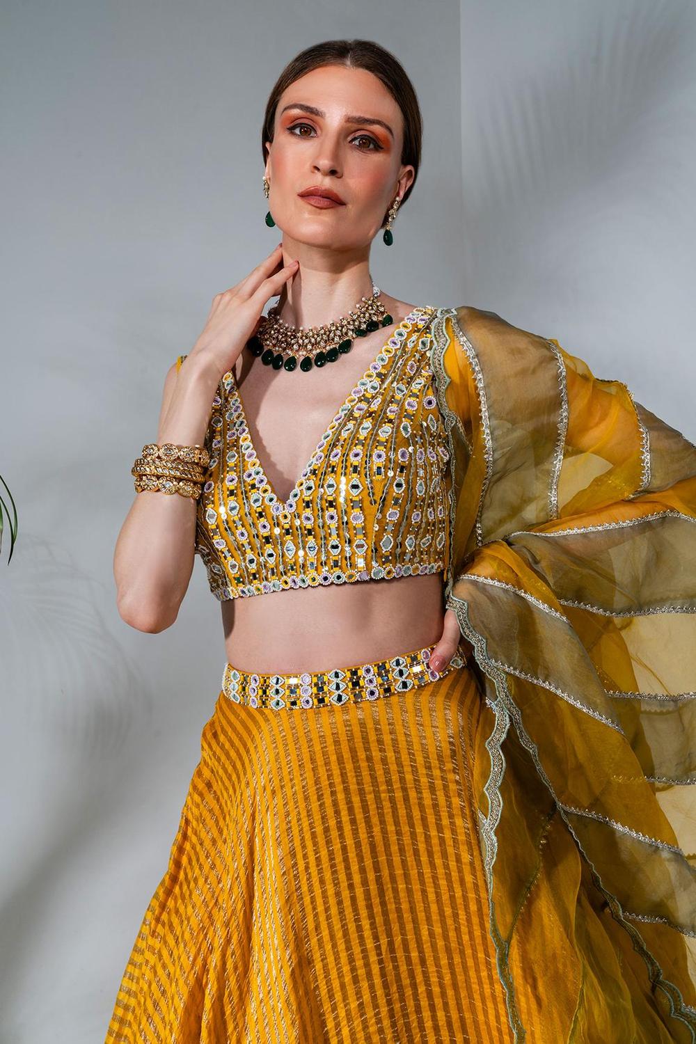 Yellow tissue silk lehenga with mirror work